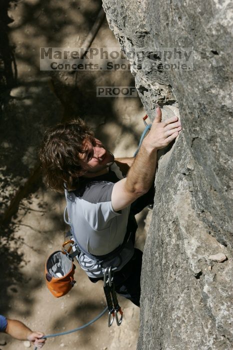 Andrew Dreher leading Lick the Window (5.10c), shot from the top of Ack! (5.11b, but using the crack for the start instead) that I top roped up with my camera on my back.  It was another long day of rock climbing at Seismic Wall on Austin's Barton Creek Greenbelt, Sunday, April 5, 2009.

Filename: SRM_20090405_13213653.jpg
Aperture: f/11.0
Shutter Speed: 1/500
Body: Canon EOS-1D Mark II
Lens: Canon EF 80-200mm f/2.8 L