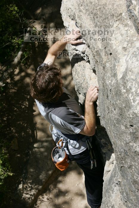 Andrew Dreher leading Lick the Window (5.10c), shot from the top of Ack! (5.11b, but using the crack for the start instead) that I top roped up with my camera on my back.  It was another long day of rock climbing at Seismic Wall on Austin's Barton Creek Greenbelt, Sunday, April 5, 2009.

Filename: SRM_20090405_13215261.jpg
Aperture: f/9.0
Shutter Speed: 1/500
Body: Canon EOS-1D Mark II
Lens: Canon EF 80-200mm f/2.8 L