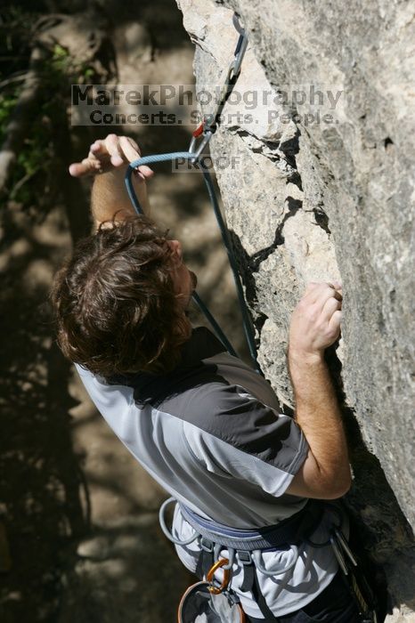 Andrew Dreher leading Lick the Window (5.10c), shot from the top of Ack! (5.11b, but using the crack for the start instead) that I top roped up with my camera on my back.  It was another long day of rock climbing at Seismic Wall on Austin's Barton Creek Greenbelt, Sunday, April 5, 2009.

Filename: SRM_20090405_13220469.jpg
Aperture: f/9.0
Shutter Speed: 1/500
Body: Canon EOS-1D Mark II
Lens: Canon EF 80-200mm f/2.8 L