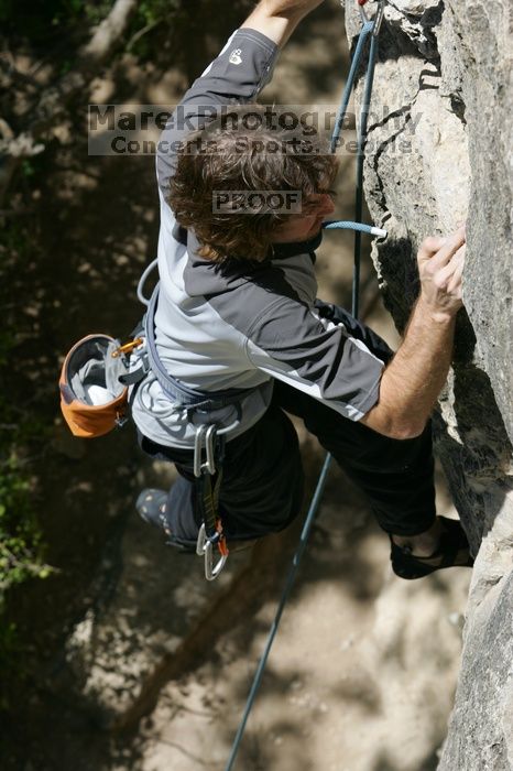 Andrew Dreher leading Lick the Window (5.10c), shot from the top of Ack! (5.11b, but using the crack for the start instead) that I top roped up with my camera on my back.  It was another long day of rock climbing at Seismic Wall on Austin's Barton Creek Greenbelt, Sunday, April 5, 2009.

Filename: SRM_20090405_13223375.jpg
Aperture: f/9.0
Shutter Speed: 1/500
Body: Canon EOS-1D Mark II
Lens: Canon EF 80-200mm f/2.8 L