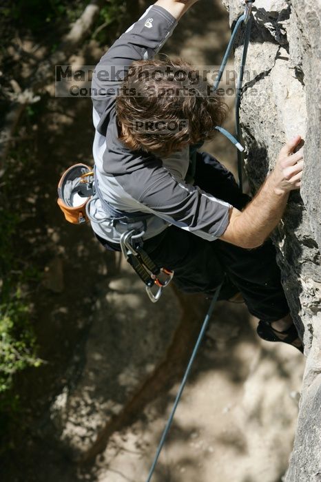 Andrew Dreher leading Lick the Window (5.10c), shot from the top of Ack! (5.11b, but using the crack for the start instead) that I top roped up with my camera on my back.  It was another long day of rock climbing at Seismic Wall on Austin's Barton Creek Greenbelt, Sunday, April 5, 2009.

Filename: SRM_20090405_13223477.jpg
Aperture: f/8.0
Shutter Speed: 1/500
Body: Canon EOS-1D Mark II
Lens: Canon EF 80-200mm f/2.8 L