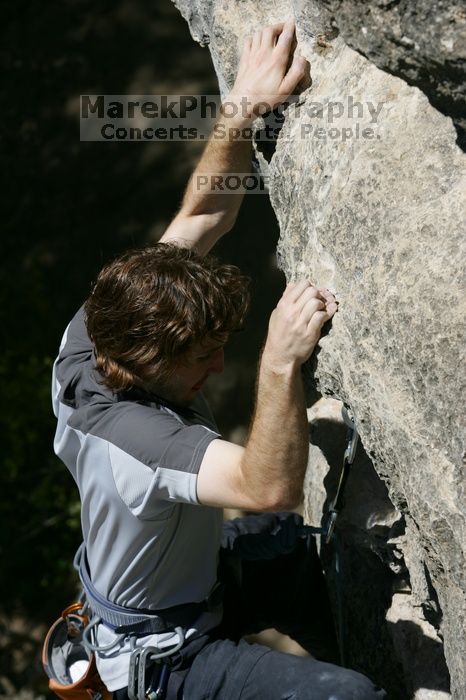 Andrew Dreher leading Lick the Window (5.10c), shot from the top of Ack! (5.11b, but using the crack for the start instead) that I top roped up with my camera on my back.  It was another long day of rock climbing at Seismic Wall on Austin's Barton Creek Greenbelt, Sunday, April 5, 2009.

Filename: SRM_20090405_13225591.jpg
Aperture: f/7.1
Shutter Speed: 1/500
Body: Canon EOS-1D Mark II
Lens: Canon EF 80-200mm f/2.8 L