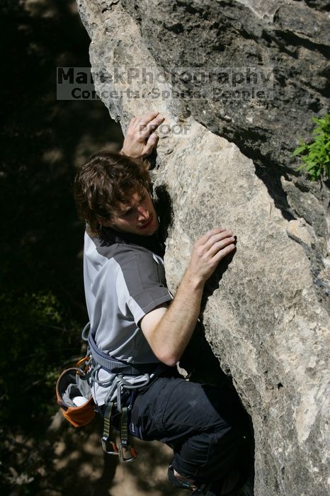 Andrew Dreher leading Lick the Window (5.10c), shot from the top of Ack! (5.11b, but using the crack for the start instead) that I top roped up with my camera on my back.  It was another long day of rock climbing at Seismic Wall on Austin's Barton Creek Greenbelt, Sunday, April 5, 2009.

Filename: SRM_20090405_13230005.jpg
Aperture: f/8.0
Shutter Speed: 1/500
Body: Canon EOS-1D Mark II
Lens: Canon EF 80-200mm f/2.8 L