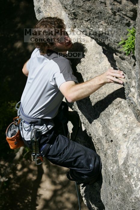 Andrew Dreher leading Lick the Window (5.10c), shot from the top of Ack! (5.11b, but using the crack for the start instead) that I top roped up with my camera on my back.  It was another long day of rock climbing at Seismic Wall on Austin's Barton Creek Greenbelt, Sunday, April 5, 2009.

Filename: SRM_20090405_13230409.jpg
Aperture: f/7.1
Shutter Speed: 1/500
Body: Canon EOS-1D Mark II
Lens: Canon EF 80-200mm f/2.8 L