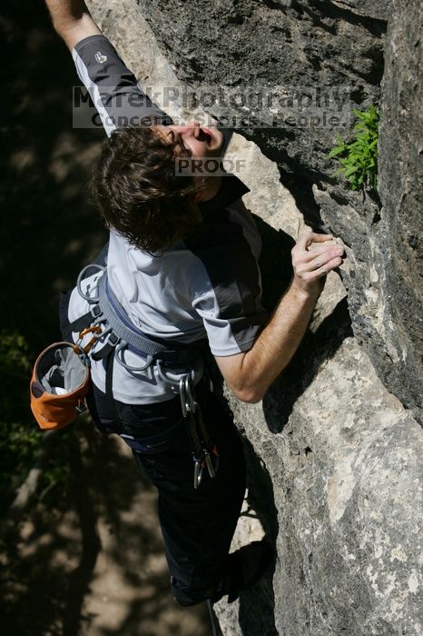 Andrew Dreher leading Lick the Window (5.10c), shot from the top of Ack! (5.11b, but using the crack for the start instead) that I top roped up with my camera on my back.  It was another long day of rock climbing at Seismic Wall on Austin's Barton Creek Greenbelt, Sunday, April 5, 2009.

Filename: SRM_20090405_13230714.jpg
Aperture: f/8.0
Shutter Speed: 1/500
Body: Canon EOS-1D Mark II
Lens: Canon EF 80-200mm f/2.8 L