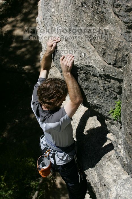 Andrew Dreher leading Lick the Window (5.10c), shot from the top of Ack! (5.11b, but using the crack for the start instead) that I top roped up with my camera on my back.  It was another long day of rock climbing at Seismic Wall on Austin's Barton Creek Greenbelt, Sunday, April 5, 2009.

Filename: SRM_20090405_13231215.jpg
Aperture: f/7.1
Shutter Speed: 1/500
Body: Canon EOS-1D Mark II
Lens: Canon EF 80-200mm f/2.8 L