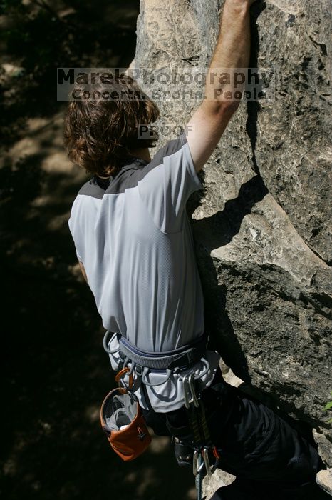 Andrew Dreher leading Lick the Window (5.10c), shot from the top of Ack! (5.11b, but using the crack for the start instead) that I top roped up with my camera on my back.  It was another long day of rock climbing at Seismic Wall on Austin's Barton Creek Greenbelt, Sunday, April 5, 2009.

Filename: SRM_20090405_13231824.jpg
Aperture: f/8.0
Shutter Speed: 1/500
Body: Canon EOS-1D Mark II
Lens: Canon EF 80-200mm f/2.8 L