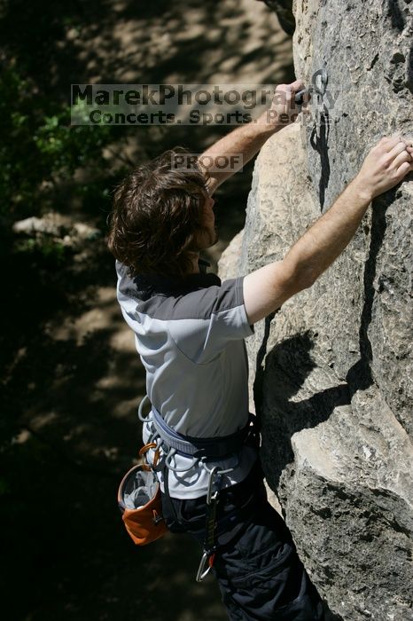 Andrew Dreher leading Lick the Window (5.10c), shot from the top of Ack! (5.11b, but using the crack for the start instead) that I top roped up with my camera on my back.  It was another long day of rock climbing at Seismic Wall on Austin's Barton Creek Greenbelt, Sunday, April 5, 2009.

Filename: SRM_20090405_13232326.jpg
Aperture: f/6.3
Shutter Speed: 1/500
Body: Canon EOS-1D Mark II
Lens: Canon EF 80-200mm f/2.8 L