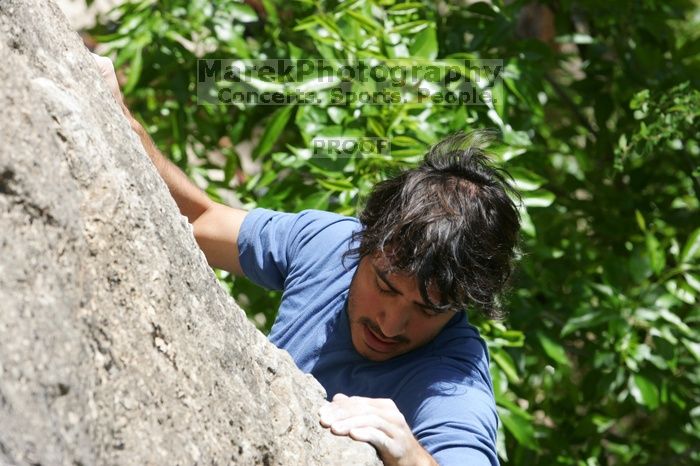 Javier Morales leading Nose Print on the Windshield (5.11c), shot from the top of Ack! (5.11b, but using the crack for the start instead) that I top roped up with my camera on my back.  It was another long day of rock climbing at Seismic Wall on Austin's Barton Creek Greenbelt, Sunday, April 5, 2009.

Filename: SRM_20090405_13335377.jpg
Aperture: f/8.0
Shutter Speed: 1/500
Body: Canon EOS-1D Mark II
Lens: Canon EF 80-200mm f/2.8 L