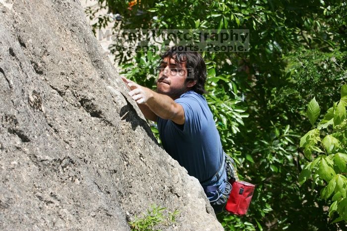 Javier Morales leading Nose Print on the Windshield (5.11c), shot from the top of Ack! (5.11b, but using the crack for the start instead) that I top roped up with my camera on my back.  It was another long day of rock climbing at Seismic Wall on Austin's Barton Creek Greenbelt, Sunday, April 5, 2009.

Filename: SRM_20090405_13335779.jpg
Aperture: f/9.0
Shutter Speed: 1/500
Body: Canon EOS-1D Mark II
Lens: Canon EF 80-200mm f/2.8 L