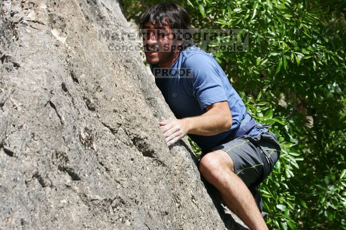 Javier Morales leading Nose Print on the Windshield (5.11c), shot from the top of Ack! (5.11b, but using the crack for the start instead) that I top roped up with my camera on my back.  It was another long day of rock climbing at Seismic Wall on Austin's Barton Creek Greenbelt, Sunday, April 5, 2009.

Filename: SRM_20090405_13340486.jpg
Aperture: f/9.0
Shutter Speed: 1/500
Body: Canon EOS-1D Mark II
Lens: Canon EF 80-200mm f/2.8 L