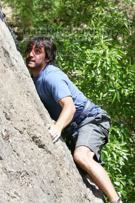 Javier Morales leading Nose Print on the Windshield (5.11c), shot from the top of Ack! (5.11b, but using the crack for the start instead) that I top roped up with my camera on my back.  It was another long day of rock climbing at Seismic Wall on Austin's Barton Creek Greenbelt, Sunday, April 5, 2009.

Filename: SRM_20090405_13371411.jpg
Aperture: f/7.1
Shutter Speed: 1/500
Body: Canon EOS-1D Mark II
Lens: Canon EF 80-200mm f/2.8 L