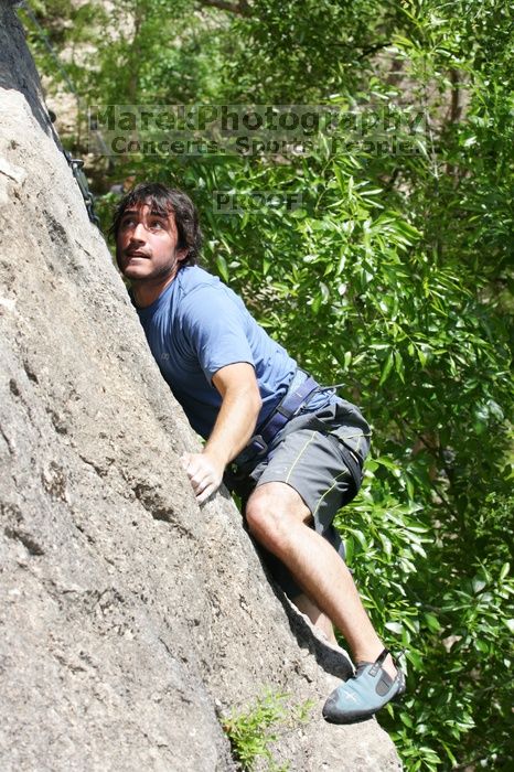 Javier Morales leading Nose Print on the Windshield (5.11c), shot from the top of Ack! (5.11b, but using the crack for the start instead) that I top roped up with my camera on my back.  It was another long day of rock climbing at Seismic Wall on Austin's Barton Creek Greenbelt, Sunday, April 5, 2009.

Filename: SRM_20090405_13371513.jpg
Aperture: f/7.1
Shutter Speed: 1/500
Body: Canon EOS-1D Mark II
Lens: Canon EF 80-200mm f/2.8 L