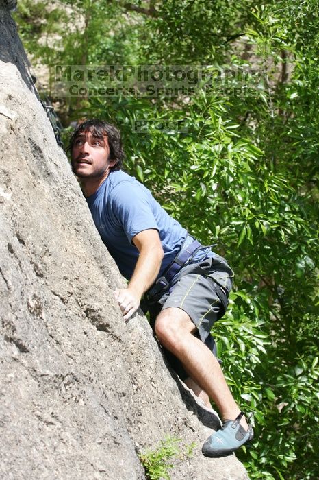 Javier Morales leading Nose Print on the Windshield (5.11c), shot from the top of Ack! (5.11b, but using the crack for the start instead) that I top roped up with my camera on my back.  It was another long day of rock climbing at Seismic Wall on Austin's Barton Creek Greenbelt, Sunday, April 5, 2009.

Filename: SRM_20090405_13371514.jpg
Aperture: f/7.1
Shutter Speed: 1/500
Body: Canon EOS-1D Mark II
Lens: Canon EF 80-200mm f/2.8 L