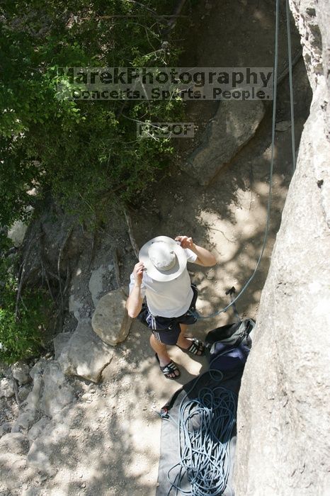 Me preparing to top rope Lick the Window (5.10c), shot (by Andrew Dreher) from the top of Ack! (5.11b, but using the crack for the start instead) that I top roped up with my camera on my back.  It was another long day of rock climbing at Seismic Wall on Austin's Barton Creek Greenbelt, Sunday, April 5, 2009.

Filename: SRM_20090405_14311624.jpg
Aperture: f/6.3
Shutter Speed: 1/500
Body: Canon EOS-1D Mark II
Lens: Canon EF 80-200mm f/2.8 L