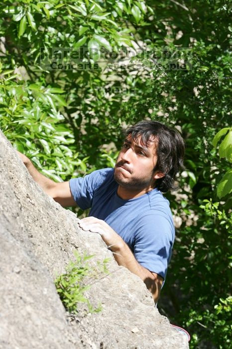 Javier Morales leading Nose Print on the Windshield (5.11c), shot from the top of Ack! (5.11b, but using the crack for the start instead) that I top roped up with my camera on my back.  It was another long day of rock climbing at Seismic Wall on Austin's Barton Creek Greenbelt, Sunday, April 5, 2009.

Filename: SRM_20090405_14561283.jpg
Aperture: f/8.0
Shutter Speed: 1/500
Body: Canon EOS-1D Mark II
Lens: Canon EF 80-200mm f/2.8 L