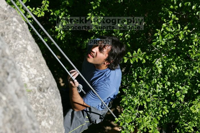 Javier Morales top rope climbing She's No Dog, She's My Wife (5.11b), shot from the top of Ack! (5.11b, but using the crack for the start instead) that I top roped up with my camera on my back.  It was another long day of rock climbing at Seismic Wall on Austin's Barton Creek Greenbelt, Sunday, April 5, 2009.

Filename: SRM_20090405_16093190.jpg
Aperture: f/10.0
Shutter Speed: 1/500
Body: Canon EOS-1D Mark II
Lens: Canon EF 80-200mm f/2.8 L