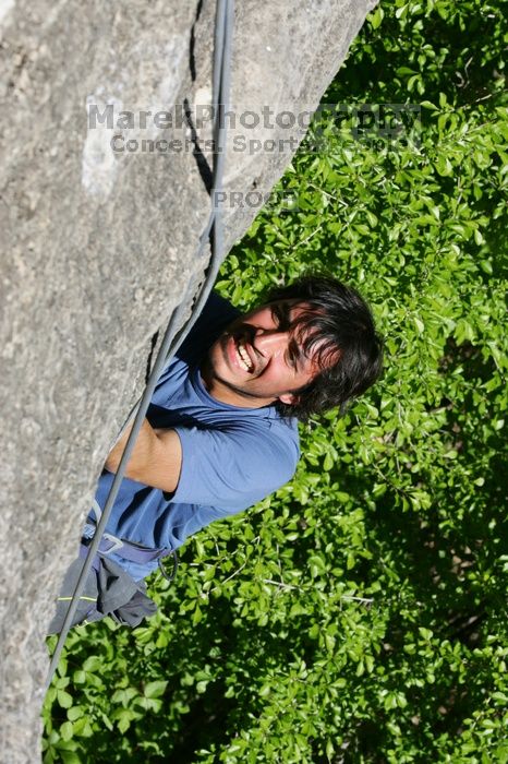 Javier Morales top rope climbing She's No Dog, She's My Wife (5.11b), shot from the top of Ack! (5.11b, but using the crack for the start instead) that I top roped up with my camera on my back.  It was another long day of rock climbing at Seismic Wall on Austin's Barton Creek Greenbelt, Sunday, April 5, 2009.

Filename: SRM_20090405_16171592.jpg
Aperture: f/11.0
Shutter Speed: 1/500
Body: Canon EOS-1D Mark II
Lens: Canon EF 80-200mm f/2.8 L