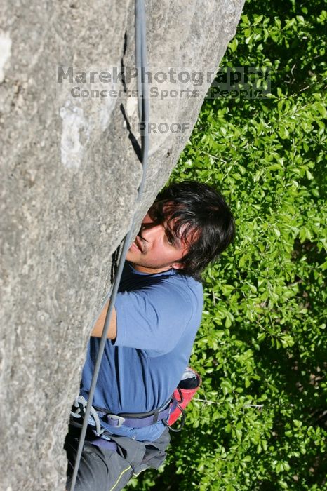 Javier Morales top rope climbing She's No Dog, She's My Wife (5.11b), shot from the top of Ack! (5.11b, but using the crack for the start instead) that I top roped up with my camera on my back.  It was another long day of rock climbing at Seismic Wall on Austin's Barton Creek Greenbelt, Sunday, April 5, 2009.

Filename: SRM_20090405_16171694.jpg
Aperture: f/11.0
Shutter Speed: 1/500
Body: Canon EOS-1D Mark II
Lens: Canon EF 80-200mm f/2.8 L