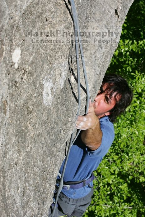 Javier Morales top rope climbing She's No Dog, She's My Wife (5.11b), shot from the top of Ack! (5.11b, but using the crack for the start instead) that I top roped up with my camera on my back.  It was another long day of rock climbing at Seismic Wall on Austin's Barton Creek Greenbelt, Sunday, April 5, 2009.

Filename: SRM_20090405_16172405.jpg
Aperture: f/13.0
Shutter Speed: 1/500
Body: Canon EOS-1D Mark II
Lens: Canon EF 80-200mm f/2.8 L