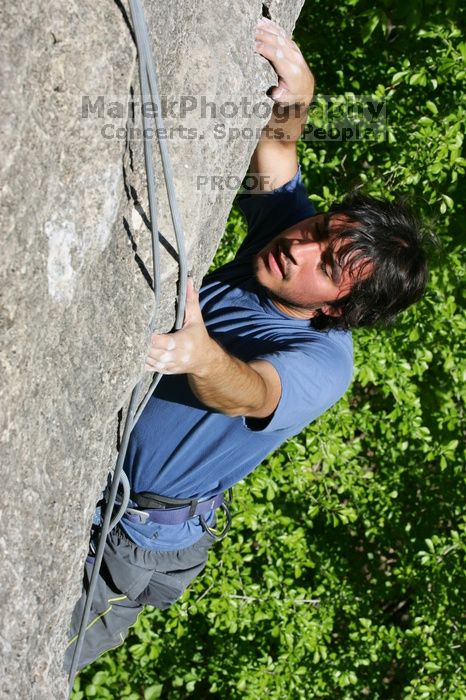 Javier Morales top rope climbing She's No Dog, She's My Wife (5.11b), shot from the top of Ack! (5.11b, but using the crack for the start instead) that I top roped up with my camera on my back.  It was another long day of rock climbing at Seismic Wall on Austin's Barton Creek Greenbelt, Sunday, April 5, 2009.

Filename: SRM_20090405_16172907.jpg
Aperture: f/10.0
Shutter Speed: 1/500
Body: Canon EOS-1D Mark II
Lens: Canon EF 80-200mm f/2.8 L