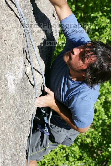 Javier Morales top rope climbing She's No Dog, She's My Wife (5.11b), shot from the top of Ack! (5.11b, but using the crack for the start instead) that I top roped up with my camera on my back.  It was another long day of rock climbing at Seismic Wall on Austin's Barton Creek Greenbelt, Sunday, April 5, 2009.

Filename: SRM_20090405_16173614.jpg
Aperture: f/9.0
Shutter Speed: 1/500
Body: Canon EOS-1D Mark II
Lens: Canon EF 80-200mm f/2.8 L