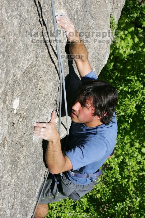 Javier Morales top rope climbing She's No Dog, She's My Wife (5.11b), shot from the top of Ack! (5.11b, but using the crack for the start instead) that I top roped up with my camera on my back.  It was another long day of rock climbing at Seismic Wall on Austin's Barton Creek Greenbelt, Sunday, April 5, 2009.

Filename: SRM_20090405_16173818.jpg
Aperture: f/10.0
Shutter Speed: 1/500
Body: Canon EOS-1D Mark II
Lens: Canon EF 80-200mm f/2.8 L