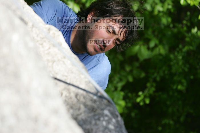 Javier Morales top rope climbing She's No Dog, She's My Wife (5.11b), shot from the top of Ack! (5.11b, but using the crack for the start instead) that I top roped up with my camera on my back.  It was another long day of rock climbing at Seismic Wall on Austin's Barton Creek Greenbelt, Sunday, April 5, 2009.

Filename: SRM_20090405_16472634.jpg
Aperture: f/4.5
Shutter Speed: 1/500
Body: Canon EOS-1D Mark II
Lens: Canon EF 80-200mm f/2.8 L