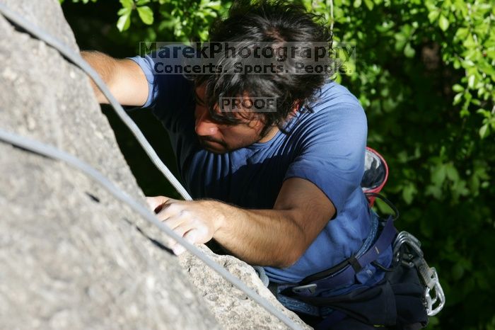 Javier Morales top rope climbing She's No Dog, She's My Wife (5.11b), shot from the top of Ack! (5.11b, but using the crack for the start instead) that I top roped up with my camera on my back.  It was another long day of rock climbing at Seismic Wall on Austin's Barton Creek Greenbelt, Sunday, April 5, 2009.

Filename: SRM_20090405_16475941.jpg
Aperture: f/9.0
Shutter Speed: 1/400
Body: Canon EOS-1D Mark II
Lens: Canon EF 80-200mm f/2.8 L