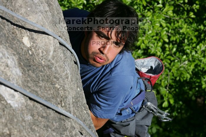 Javier Morales top rope climbing She's No Dog, She's My Wife (5.11b), shot from the top of Ack! (5.11b, but using the crack for the start instead) that I top roped up with my camera on my back.  It was another long day of rock climbing at Seismic Wall on Austin's Barton Creek Greenbelt, Sunday, April 5, 2009.

Filename: SRM_20090405_16481246.jpg
Aperture: f/9.0
Shutter Speed: 1/500
Body: Canon EOS-1D Mark II
Lens: Canon EF 80-200mm f/2.8 L