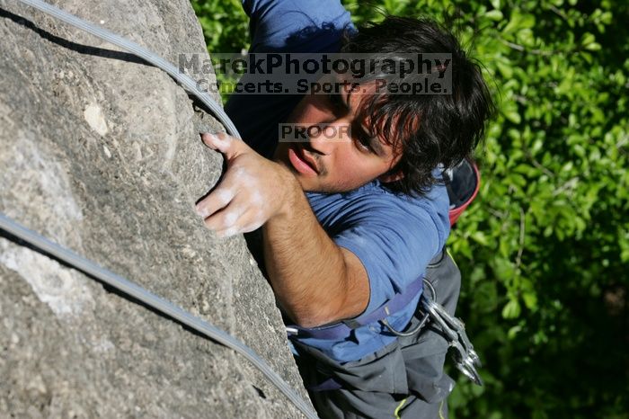 Javier Morales top rope climbing She's No Dog, She's My Wife (5.11b), shot from the top of Ack! (5.11b, but using the crack for the start instead) that I top roped up with my camera on my back.  It was another long day of rock climbing at Seismic Wall on Austin's Barton Creek Greenbelt, Sunday, April 5, 2009.

Filename: SRM_20090405_16481749.jpg
Aperture: f/9.0
Shutter Speed: 1/500
Body: Canon EOS-1D Mark II
Lens: Canon EF 80-200mm f/2.8 L