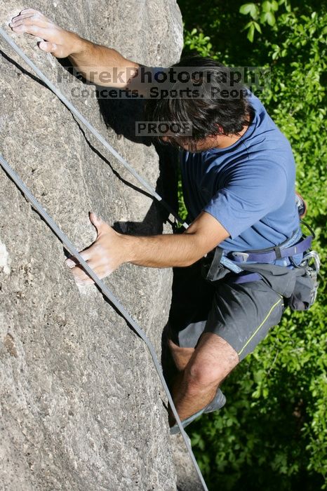 Javier Morales top rope climbing She's No Dog, She's My Wife (5.11b), shot from the top of Ack! (5.11b, but using the crack for the start instead) that I top roped up with my camera on my back.  It was another long day of rock climbing at Seismic Wall on Austin's Barton Creek Greenbelt, Sunday, April 5, 2009.

Filename: SRM_20090405_16483156.jpg
Aperture: f/8.0
Shutter Speed: 1/500
Body: Canon EOS-1D Mark II
Lens: Canon EF 80-200mm f/2.8 L