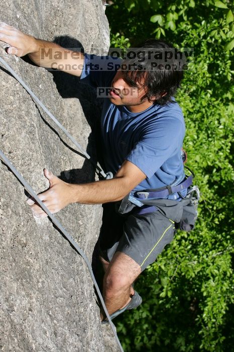 Javier Morales top rope climbing She's No Dog, She's My Wife (5.11b), shot from the top of Ack! (5.11b, but using the crack for the start instead) that I top roped up with my camera on my back.  It was another long day of rock climbing at Seismic Wall on Austin's Barton Creek Greenbelt, Sunday, April 5, 2009.

Filename: SRM_20090405_16483357.jpg
Aperture: f/8.0
Shutter Speed: 1/500
Body: Canon EOS-1D Mark II
Lens: Canon EF 80-200mm f/2.8 L