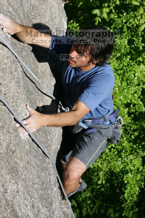 Javier Morales top rope climbing She's No Dog, She's My Wife (5.11b), shot from the top of Ack! (5.11b, but using the crack for the start instead) that I top roped up with my camera on my back.  It was another long day of rock climbing at Seismic Wall on Austin's Barton Creek Greenbelt, Sunday, April 5, 2009.

Filename: SRM_20090405_16483358.jpg
Aperture: f/8.0
Shutter Speed: 1/500
Body: Canon EOS-1D Mark II
Lens: Canon EF 80-200mm f/2.8 L