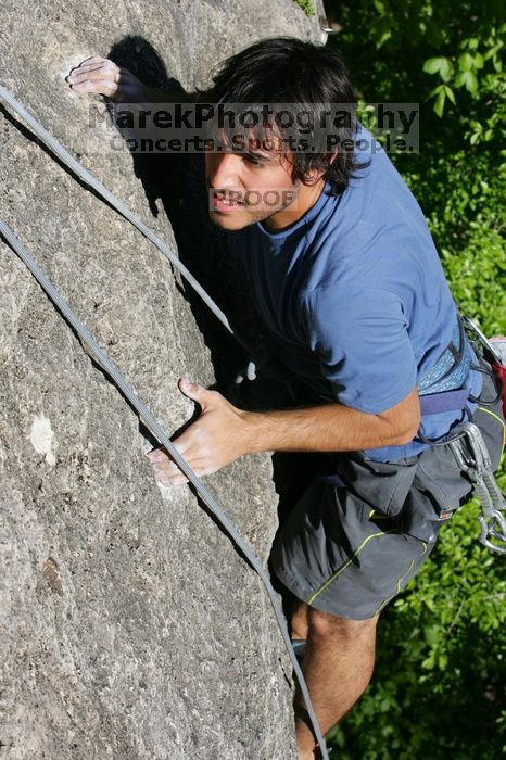 Javier Morales top rope climbing She's No Dog, She's My Wife (5.11b), shot from the top of Ack! (5.11b, but using the crack for the start instead) that I top roped up with my camera on my back.  It was another long day of rock climbing at Seismic Wall on Austin's Barton Creek Greenbelt, Sunday, April 5, 2009.

Filename: SRM_20090405_16483459.jpg
Aperture: f/9.0
Shutter Speed: 1/500
Body: Canon EOS-1D Mark II
Lens: Canon EF 80-200mm f/2.8 L