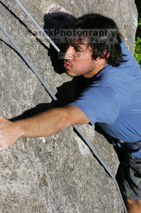 Javier Morales top rope climbing She's No Dog, She's My Wife (5.11b), shot from the top of Ack! (5.11b, but using the crack for the start instead) that I top roped up with my camera on my back.  It was another long day of rock climbing at Seismic Wall on Austin's Barton Creek Greenbelt, Sunday, April 5, 2009.

Filename: SRM_20090405_16483663.jpg
Aperture: f/10.0
Shutter Speed: 1/500
Body: Canon EOS-1D Mark II
Lens: Canon EF 80-200mm f/2.8 L