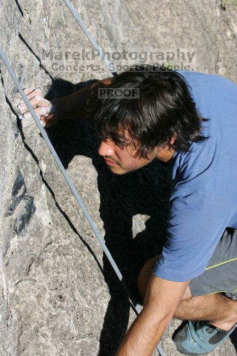 Javier Morales top rope climbing She's No Dog, She's My Wife (5.11b), shot from the top of Ack! (5.11b, but using the crack for the start instead) that I top roped up with my camera on my back.  It was another long day of rock climbing at Seismic Wall on Austin's Barton Creek Greenbelt, Sunday, April 5, 2009.

Filename: SRM_20090405_16485067.jpg
Aperture: f/8.0
Shutter Speed: 1/500
Body: Canon EOS-1D Mark II
Lens: Canon EF 80-200mm f/2.8 L