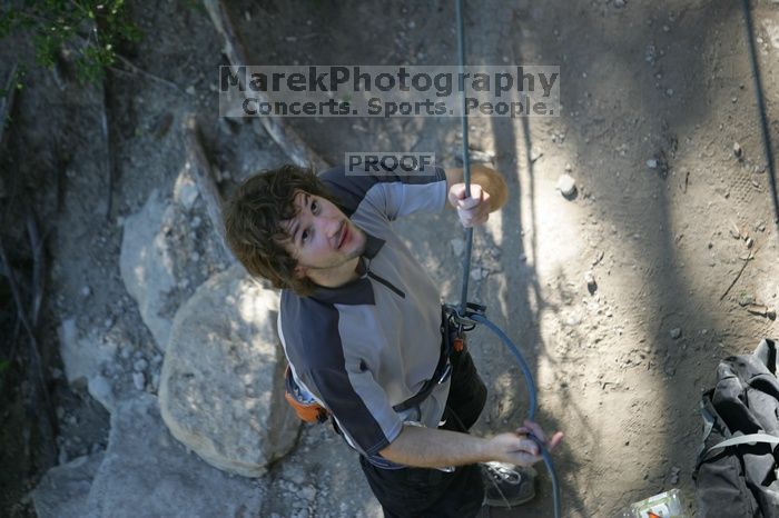 Andrew Dreher getting ready to belay me on top rope up Lick the Window (5.10c), shot by Javier Morales from the top of Ack! (5.11b, but using the crack for the start instead) that I top roped up with my camera on my back.  It was another long day of rock climbing at Seismic Wall on Austin's Barton Creek Greenbelt, Sunday, April 5, 2009.

Filename: SRM_20090405_17142978.jpg
Aperture: f/2.8
Shutter Speed: 1/400
Body: Canon EOS-1D Mark II
Lens: Canon EF 80-200mm f/2.8 L