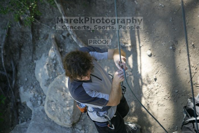 Andrew Dreher getting ready to belay me on top rope up Lick the Window (5.10c), shot by Javier Morales from the top of Ack! (5.11b, but using the crack for the start instead) that I top roped up with my camera on my back.  It was another long day of rock climbing at Seismic Wall on Austin's Barton Creek Greenbelt, Sunday, April 5, 2009.

Filename: SRM_20090405_17143180.jpg
Aperture: f/2.8
Shutter Speed: 1/400
Body: Canon EOS-1D Mark II
Lens: Canon EF 80-200mm f/2.8 L