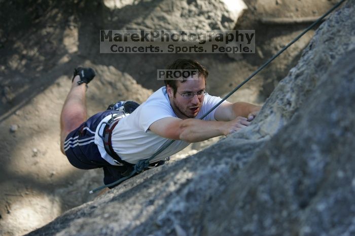 Me top roping Lick the Window (5.10c), shot by Javier Morales from the top of Ack! (5.11b, but using the crack for the start instead) that I top roped up with my camera on my back.  It was another long day of rock climbing at Seismic Wall on Austin's Barton Creek Greenbelt, Sunday, April 5, 2009.

Filename: SRM_20090405_17181606.jpg
Aperture: f/3.2
Shutter Speed: 1/400
Body: Canon EOS-1D Mark II
Lens: Canon EF 80-200mm f/2.8 L