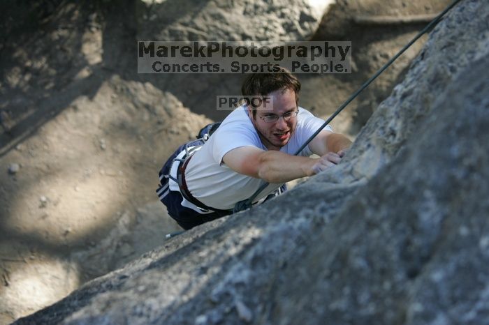 Me top roping Lick the Window (5.10c), shot by Javier Morales from the top of Ack! (5.11b, but using the crack for the start instead) that I top roped up with my camera on my back.  It was another long day of rock climbing at Seismic Wall on Austin's Barton Creek Greenbelt, Sunday, April 5, 2009.

Filename: SRM_20090405_17181609.jpg
Aperture: f/3.5
Shutter Speed: 1/400
Body: Canon EOS-1D Mark II
Lens: Canon EF 80-200mm f/2.8 L