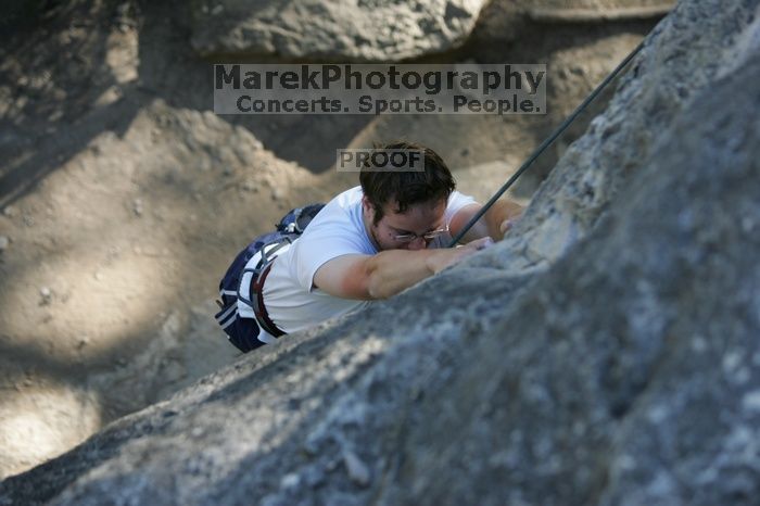 Me top roping Lick the Window (5.10c), shot by Javier Morales from the top of Ack! (5.11b, but using the crack for the start instead) that I top roped up with my camera on my back.  It was another long day of rock climbing at Seismic Wall on Austin's Barton Creek Greenbelt, Sunday, April 5, 2009.

Filename: SRM_20090405_17181712.jpg
Aperture: f/3.2
Shutter Speed: 1/400
Body: Canon EOS-1D Mark II
Lens: Canon EF 80-200mm f/2.8 L