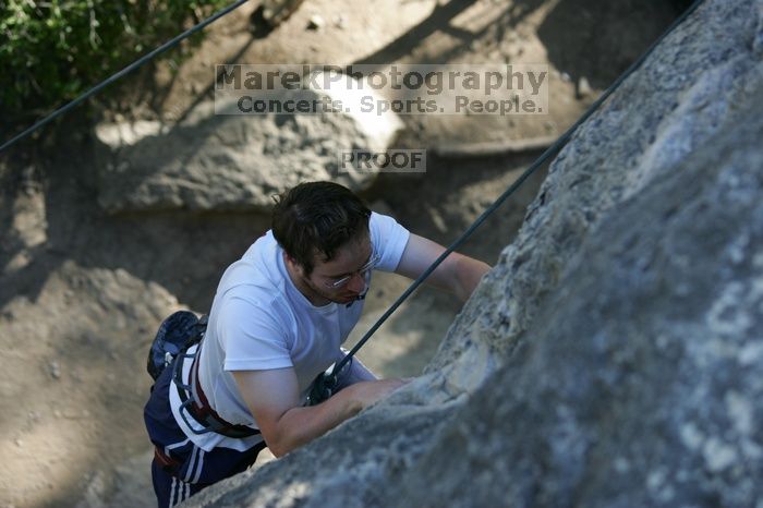 Me top roping Lick the Window (5.10c), shot by Javier Morales from the top of Ack! (5.11b, but using the crack for the start instead) that I top roped up with my camera on my back.  It was another long day of rock climbing at Seismic Wall on Austin's Barton Creek Greenbelt, Sunday, April 5, 2009.

Filename: SRM_20090405_17182121.jpg
Aperture: f/3.2
Shutter Speed: 1/400
Body: Canon EOS-1D Mark II
Lens: Canon EF 80-200mm f/2.8 L