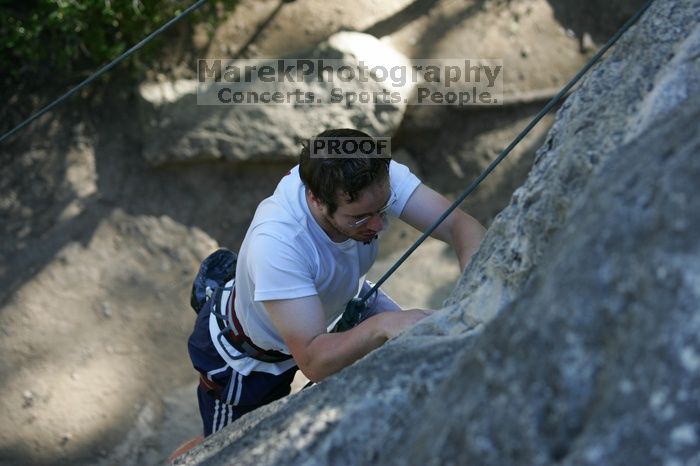 Me top roping Lick the Window (5.10c), shot by Javier Morales from the top of Ack! (5.11b, but using the crack for the start instead) that I top roped up with my camera on my back.  It was another long day of rock climbing at Seismic Wall on Austin's Barton Creek Greenbelt, Sunday, April 5, 2009.

Filename: SRM_20090405_17182324.jpg
Aperture: f/3.2
Shutter Speed: 1/400
Body: Canon EOS-1D Mark II
Lens: Canon EF 80-200mm f/2.8 L