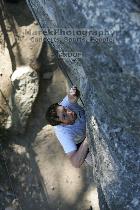 Me top roping Lick the Window (5.10c), shot by Javier Morales from the top of Ack! (5.11b, but using the crack for the start instead) that I top roped up with my camera on my back.  It was another long day of rock climbing at Seismic Wall on Austin's Barton Creek Greenbelt, Sunday, April 5, 2009.

Filename: SRM_20090405_17185852.jpg
Aperture: f/3.2
Shutter Speed: 1/400
Body: Canon EOS-1D Mark II
Lens: Canon EF 80-200mm f/2.8 L