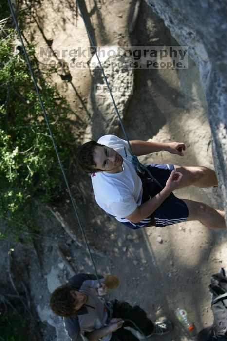 Me top roping Lick the Window (5.10c), shot by Javier Morales from the top of Ack! (5.11b, but using the crack for the start instead) that I top roped up with my camera on my back.  It was another long day of rock climbing at Seismic Wall on Austin's Barton Creek Greenbelt, Sunday, April 5, 2009.

Filename: SRM_20090405_17190668.jpg
Aperture: f/3.2
Shutter Speed: 1/400
Body: Canon EOS-1D Mark II
Lens: Canon EF 80-200mm f/2.8 L