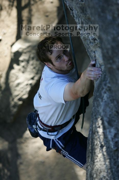 Me top roping Lick the Window (5.10c), shot by Javier Morales from the top of Ack! (5.11b, but using the crack for the start instead) that I top roped up with my camera on my back.  It was another long day of rock climbing at Seismic Wall on Austin's Barton Creek Greenbelt, Sunday, April 5, 2009.

Filename: SRM_20090405_17202379.jpg
Aperture: f/4.0
Shutter Speed: 1/400
Body: Canon EOS-1D Mark II
Lens: Canon EF 80-200mm f/2.8 L