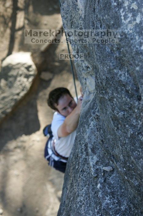 Me top roping Lick the Window (5.10c), shot by Javier Morales from the top of Ack! (5.11b, but using the crack for the start instead) that I top roped up with my camera on my back.  It was another long day of rock climbing at Seismic Wall on Austin's Barton Creek Greenbelt, Sunday, April 5, 2009.

Filename: SRM_20090405_17260838.jpg
Aperture: f/4.5
Shutter Speed: 1/320
Body: Canon EOS-1D Mark II
Lens: Canon EF 80-200mm f/2.8 L