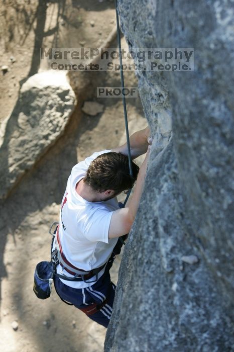 Me top roping Lick the Window (5.10c), shot by Javier Morales from the top of Ack! (5.11b, but using the crack for the start instead) that I top roped up with my camera on my back.  It was another long day of rock climbing at Seismic Wall on Austin's Barton Creek Greenbelt, Sunday, April 5, 2009.

Filename: SRM_20090405_17261043.jpg
Aperture: f/4.5
Shutter Speed: 1/320
Body: Canon EOS-1D Mark II
Lens: Canon EF 80-200mm f/2.8 L