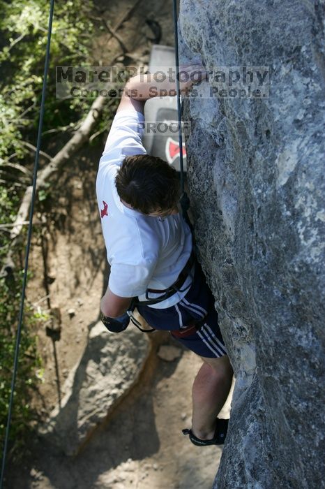 Me top roping Lick the Window (5.10c), shot by Javier Morales from the top of Ack! (5.11b, but using the crack for the start instead) that I top roped up with my camera on my back.  It was another long day of rock climbing at Seismic Wall on Austin's Barton Creek Greenbelt, Sunday, April 5, 2009.

Filename: SRM_20090405_17281018.jpg
Aperture: f/5.0
Shutter Speed: 1/320
Body: Canon EOS-1D Mark II
Lens: Canon EF 80-200mm f/2.8 L